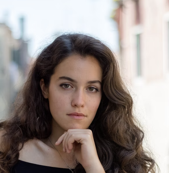 Woman with dark wavy hair